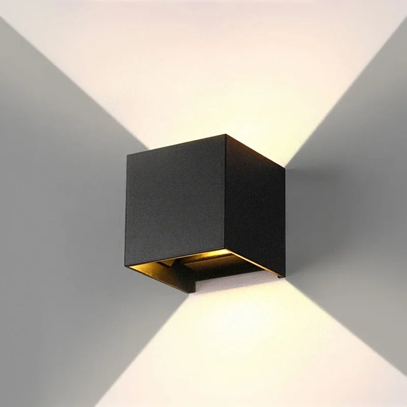 Modern black cube wall light with warm up-down illumination for contemporary interiors