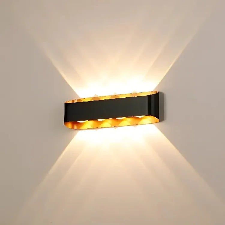 Modern black wall sconce with warm up-down lighting, ideal for contemporary interior decor